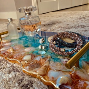 Resin tray  with seashell embelishments .